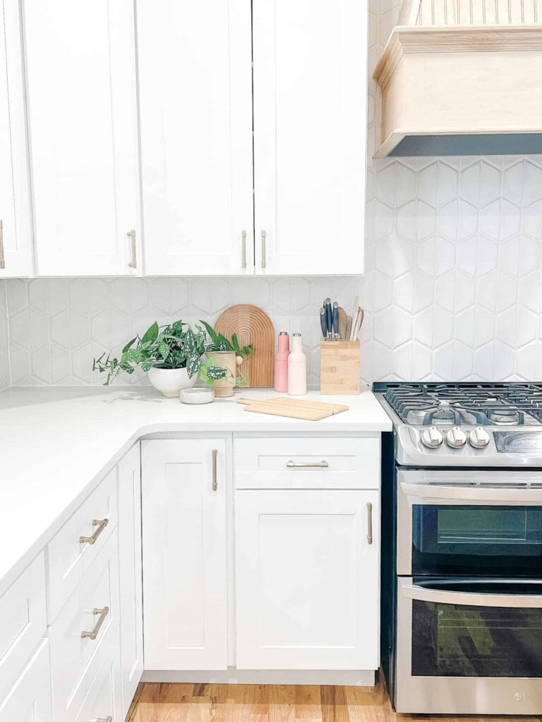 white kitchen with rainbow cutting board