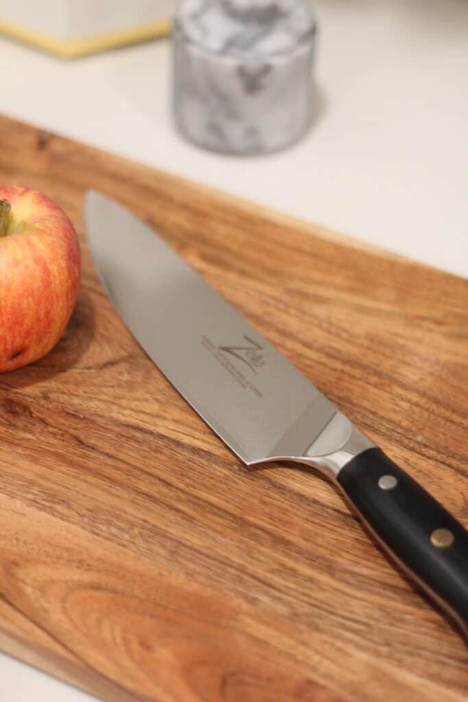 Damascus chef knife on cutting board