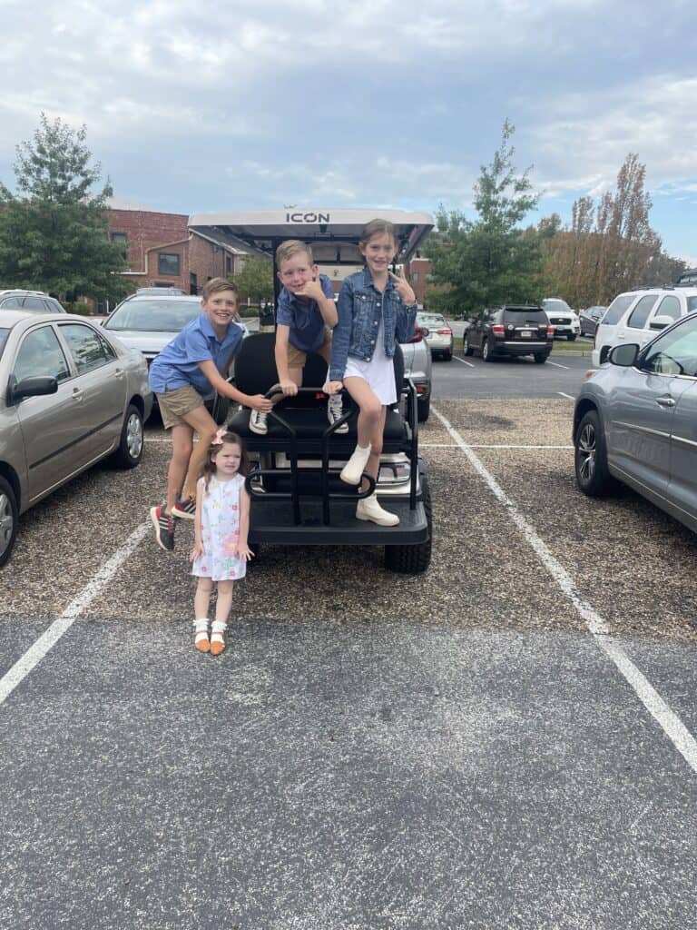 kids on golf cart