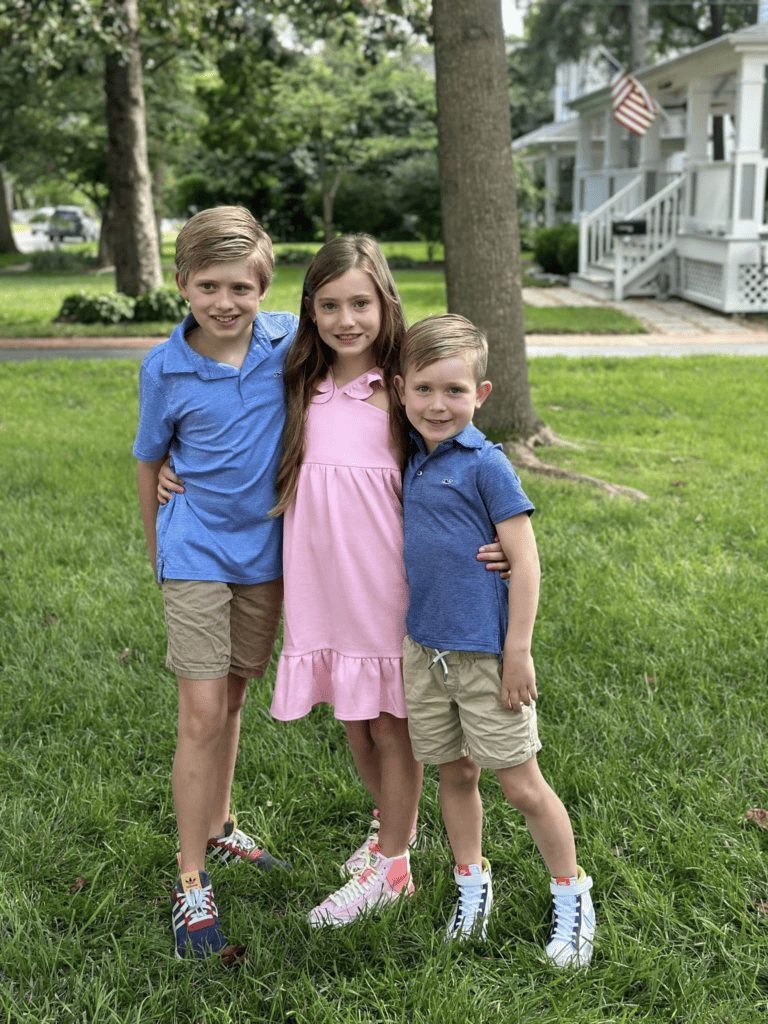 Girl and boys posing