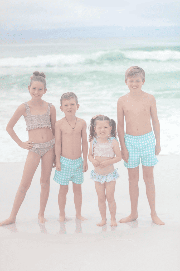 four kids on the beach