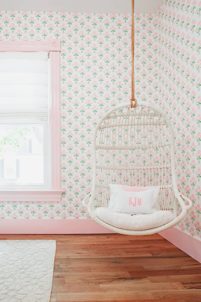 Hanging chair in grand millennial kids room