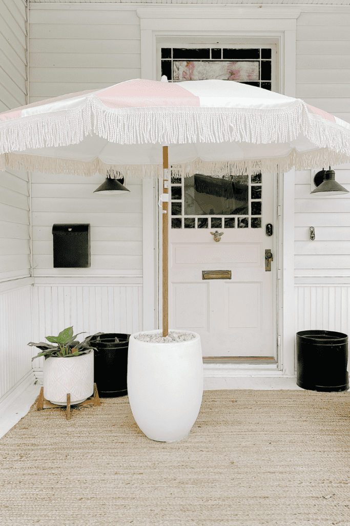 pink and white umbrella in a planter