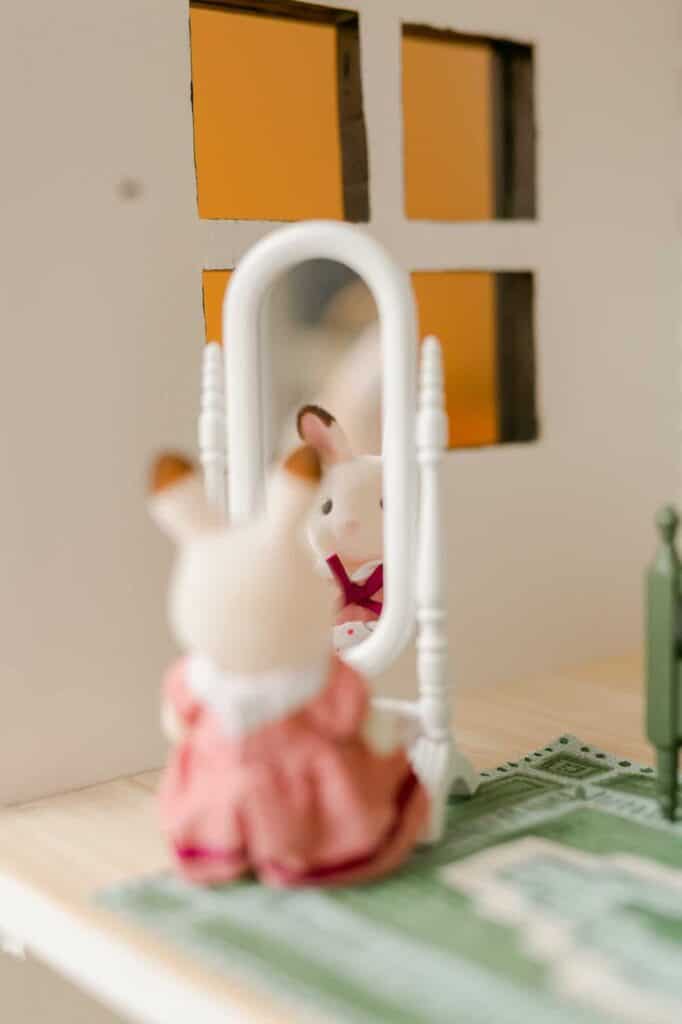 Bunny in mirror in dollhouse