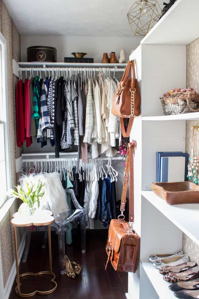 Closet with hanging purses on hooks
