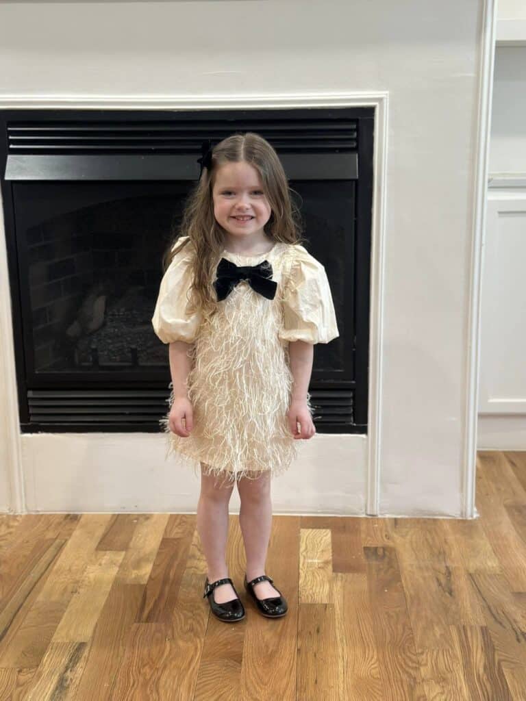 Little girl with bow tie dress