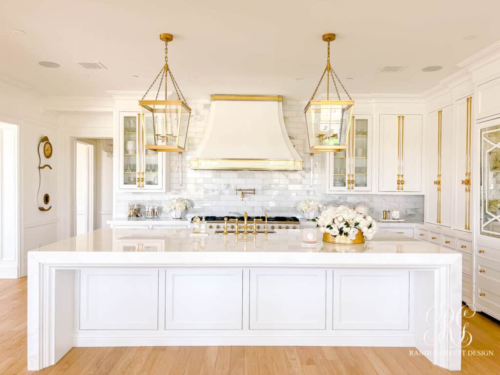 White glam kitchen reveal with gold cabinetry hardware