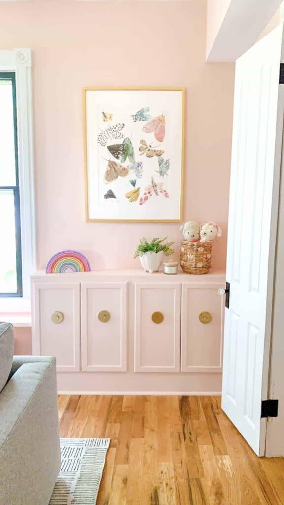 Pink playroom with built in storage stock cabinets