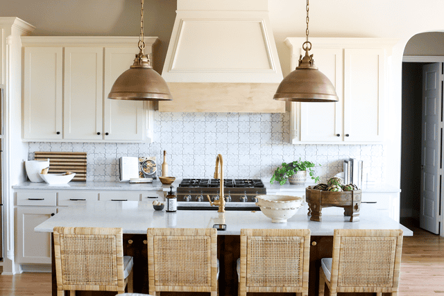 White kitchen with wood accent and rattan kitchen stools
