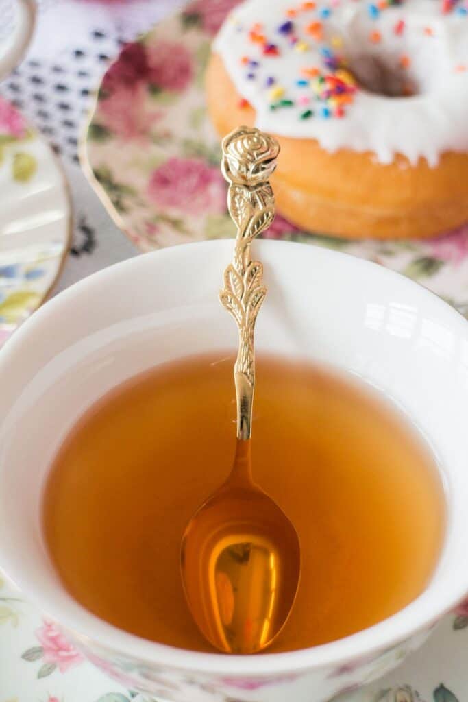 Tea cut with gold spoon