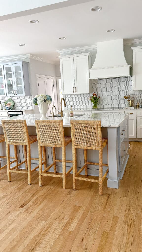 The Best Wood Flor For Your Kitchen & How To Choose white kitchen and rattan chairs