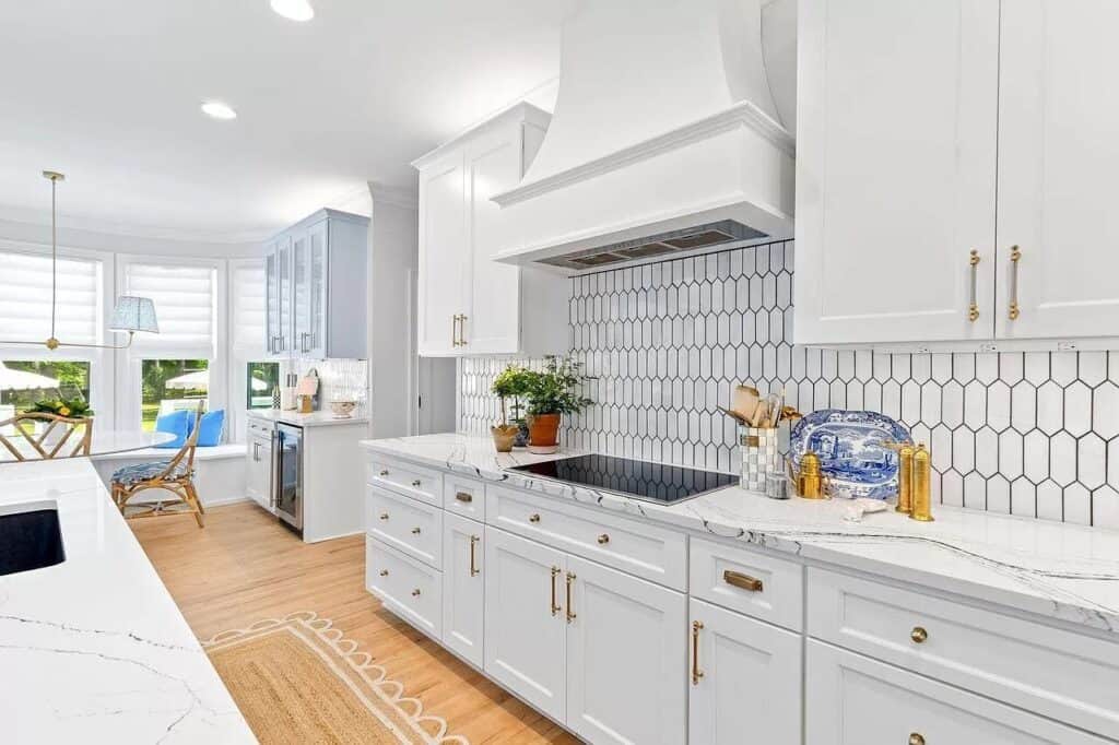 White backsplash and white cabinets in kitchen