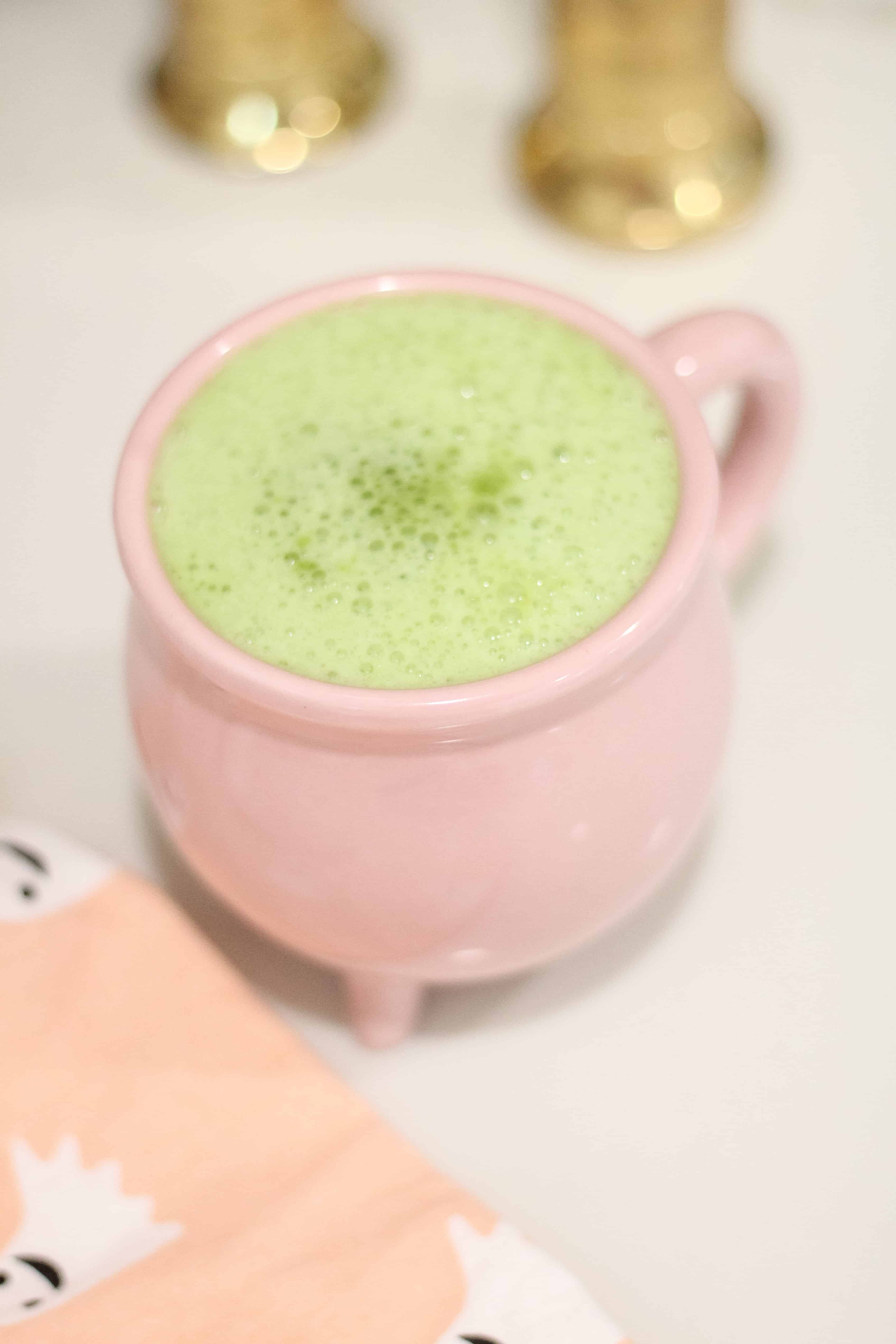 Halloween Coffee Recipes with wicked matcha latte in a pink cauldron mug